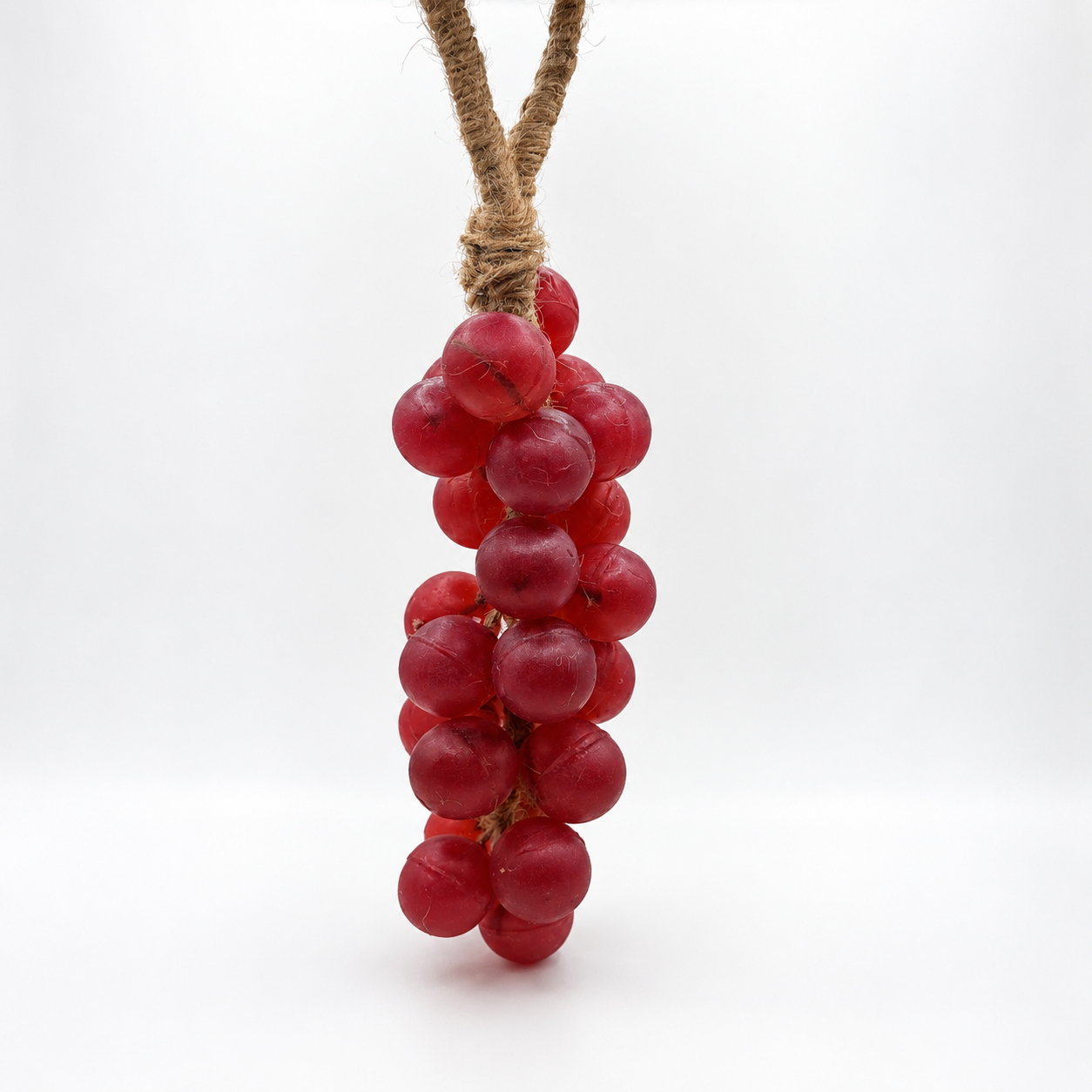 Grape Escape bunch in cranberry red, hanging on jute twine